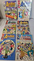 All six Archie & Friends comics laid out in two columns, top two in sealed plastic sleeves