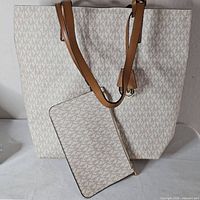 Front view of Michael Kors tote with matching wallet