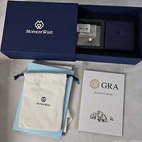 Moment Wish box, pouch, paperwork visible