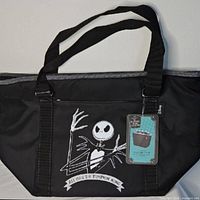 Front view of cooler tote with Jack Skellington graphic and hang tag visible