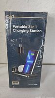 Front view of sealed retail box showing Portable 3 in 1 Charging Station, 18W Fast Charging, model W330