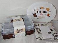 Caddy, serving tray and packaged tablecloth grouped