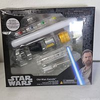 Front of sealed Star Wars Lightsaber Forge Obi-Wan Kenobi kit showing blade and hilt parts