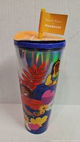 Front view of holographic Starbucks tumbler showing graphics and lid