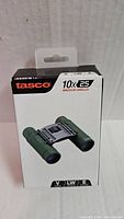 Front of Tasco retail box showing 10x25 binocular image and branding