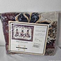 Front view of sealed Dakotah Teddy Bear Band tapestry throw