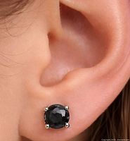 Black diamond stud worn in ear showing size and setting