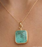 Pendant on chain worn on neck showing size and appearance