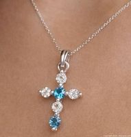 Front view of the diamond cross pendant on chain