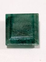 Top view of square emerald showing color and cut