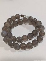 Coiled grey agate bead necklace showing overall appearance and clasp