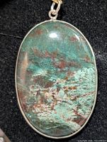 front view showing stone colors and bezel setting