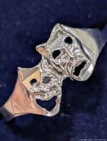 Front view showing comedy and tragedy mask faces