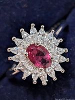 front view of ring showing ruby and CZ halo