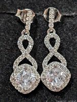 Front view of silver CZ drop earrings showing overall design