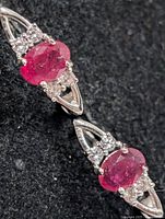 Close-up of front showing ruby and CZ settings