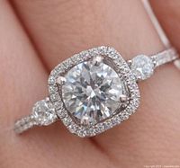 Top view of ring showing moissanite center, CZ halo and shoulder stones