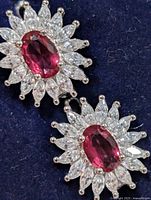 Front view showing ruby center and CZ halo