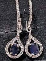 Front view showing sapphire centers and CZ halo