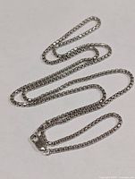 Entire chain laid out showing full length and box link style