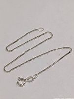 Full view of silver box chain bracelet laid flat