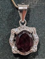 Front view of garnet halo pendant