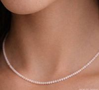 Necklace worn, showing scale and bead colour