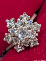 Front view of silver ring showing cluster of clear stones