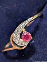 Ring top view showing ruby and accent stones