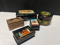 Five assorted Russian lacquer boxes grouped