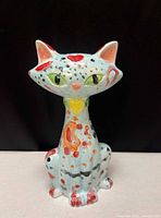 full front view of painted ceramic cat figurine