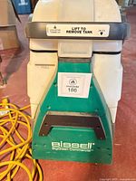 Front view showing BISSELL Big Green Commercial branding and tank area