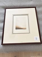 Framed print with mat and dark wood frame