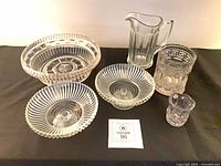 Group shot of six pressed glass pieces