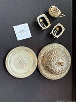 Overview of butter dish components, two salt cellars, mustard pot