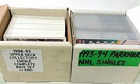 Two labeled card boxes: 1996-97 Upper Deck Collector’s Choice complete base set (1-288) and 1993-94 Parkhurst NHL singles