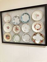 Overall view of framed set showing all 12 butter pats