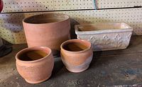Group shot of all four terracotta planters