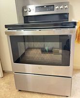 Full view of stainless steel electric range showing exterior condition