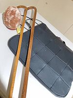 Salt lamp, both canes, and black seat cushion overview