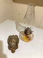 Front view of door knocker and lamp together