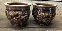 Front view of both dragon planters