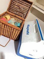 Basket and Igloo Playmate cooler side by side