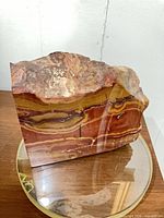 Front polished face showing banded patterns