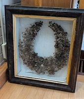Full view of shadow box with mourning wreath