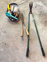 Overall lot view with hedge shears and tool caddy