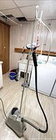 Full view of Jiffy garment steamer with pole, hose and head
