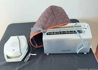 De'Longhi toaster, Sunbeam waffle maker, quilted cover on tabletop