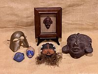 Group shot of six masks displaying full lot
