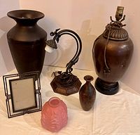 Group view of both lamps, vases, frame and glass globe